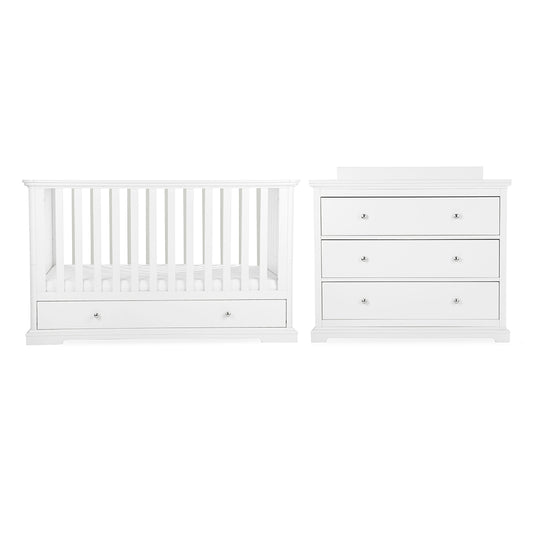 White baby furniture set including a convertible crib with built-in storage drawer and a matching three-drawer dresser, cuddle co kaliedy